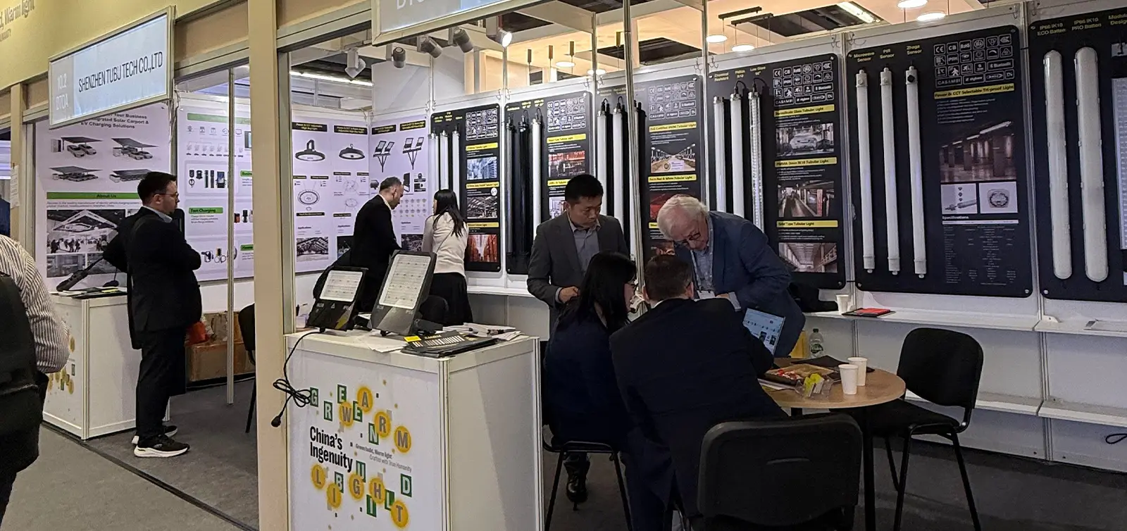 TUBU team is communicating with customers at the exhibition booth. TUBU team is communicating with customers at the exhibition booth.